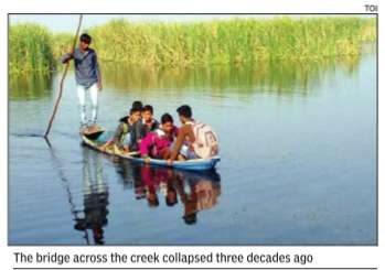 These 150 kids travel in boats across creek to reach school